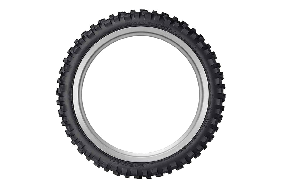 Dunlop D606: front tire fully face-on as a bare ring with no rim, the complete knob ring and sidewall lettering visible