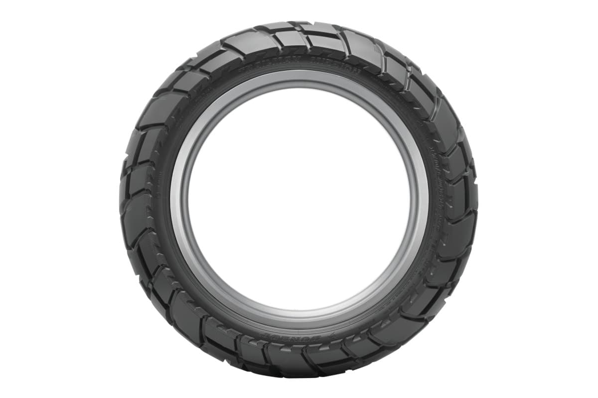 Dunlop Trailmax Mission: rear tire face-on as a full ring, whole tread circumference and the moulded sidewall lettering visible