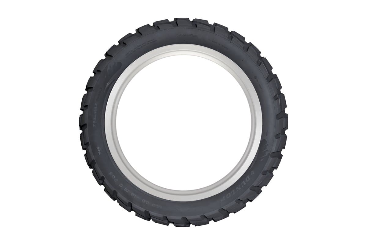 Dunlop Trailmax Raid: rear tire face-on as a full ring on its rim, moulded sidewall size markings legible
