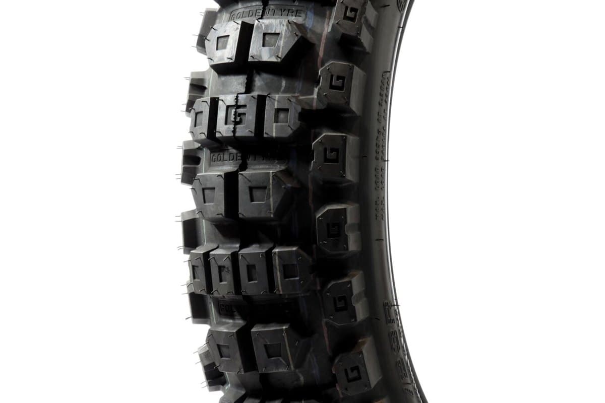 GoldenTyre GT723R / GT723RH Rally Raid: a tight crop of the knob pattern and shoulder blocks with the brand moulded into the tread, on white