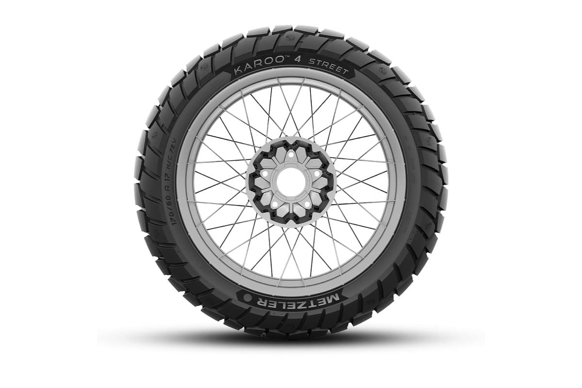 Metzeler Karoo 4 Street: flat side-on profile of the rear on a silver spoked wheel, with the model, brand and size on the sidewall
