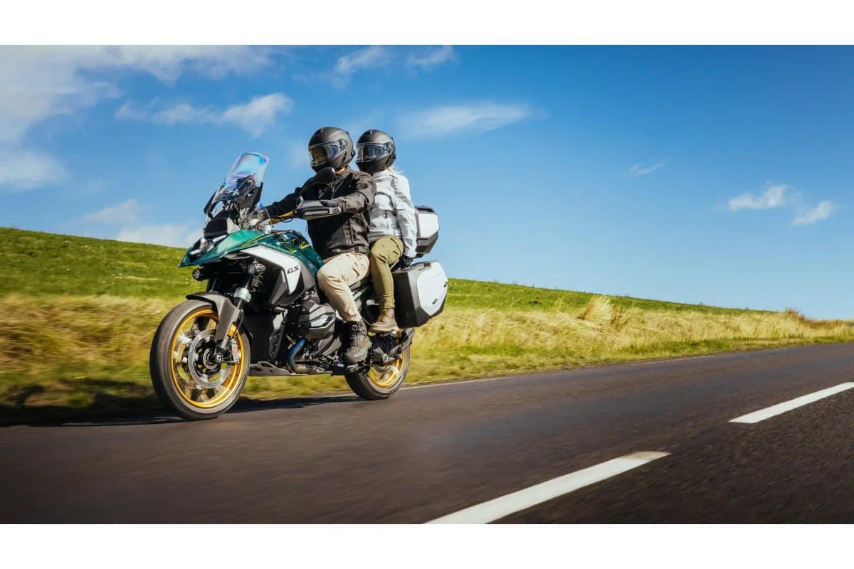Michelin Anakee Adventure 2: two-up riders at speed on a country road, side view with both wheels and tires in frame