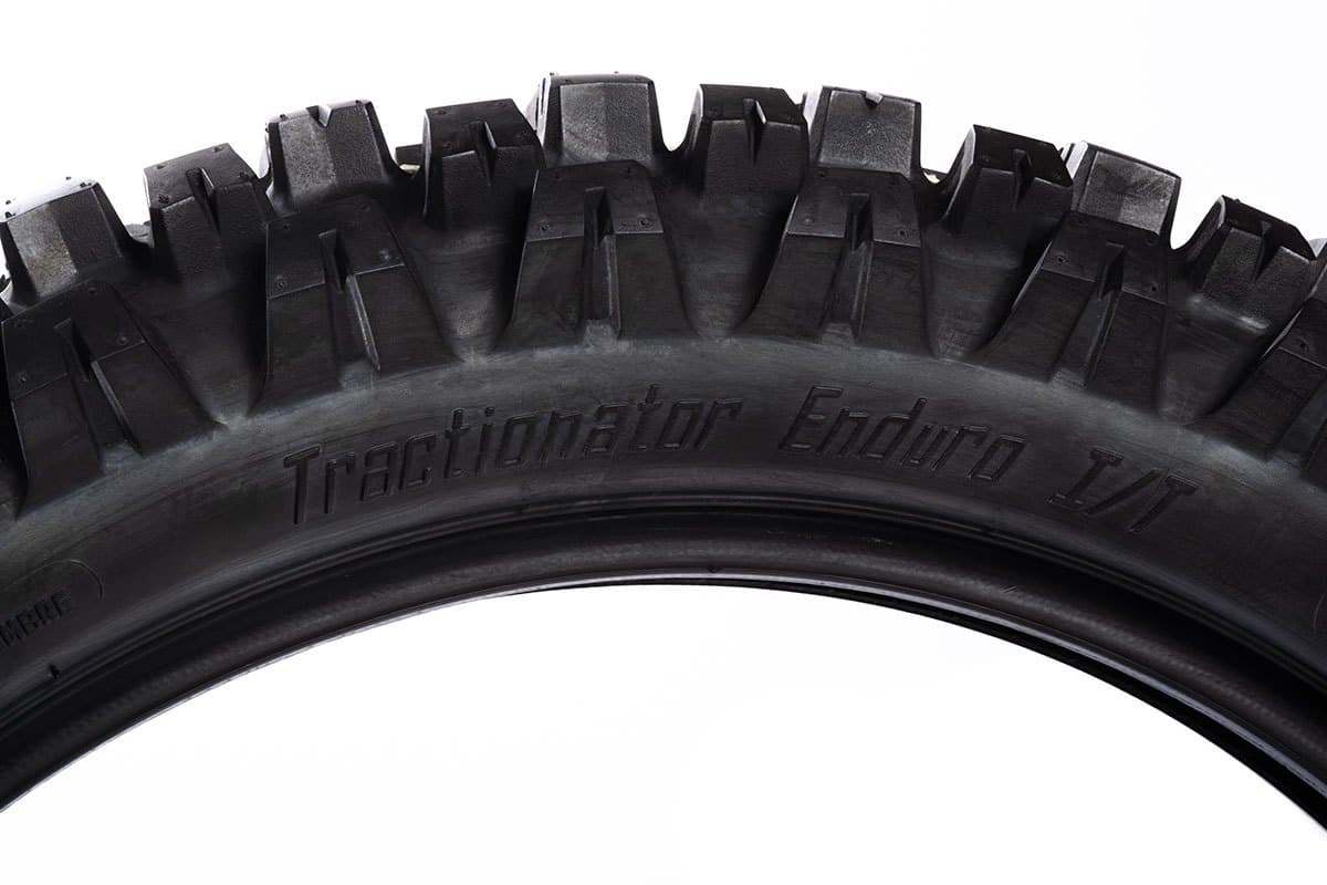 Motoz Tractionator Enduro I/T: side-on view of the tread arc with the model name moulded in the sidewall
