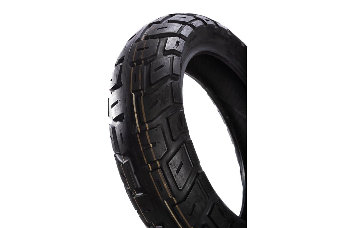 Motoz Tractionator GPS: three-quarter crop of one tire, tread face with the shoulder curving away and the inner carcass visible