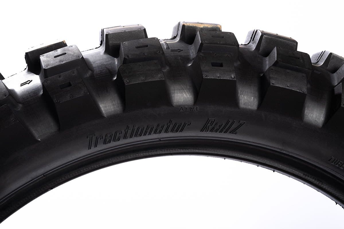 Motoz Tractionator RallZ: side-on view of the tread arc, knob silhouette, with the model name moulded in the sidewall