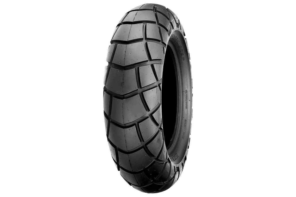 Shinko SR428: rear tire, same angle, much fatter with wider lattice blocks and a pronounced shoulder