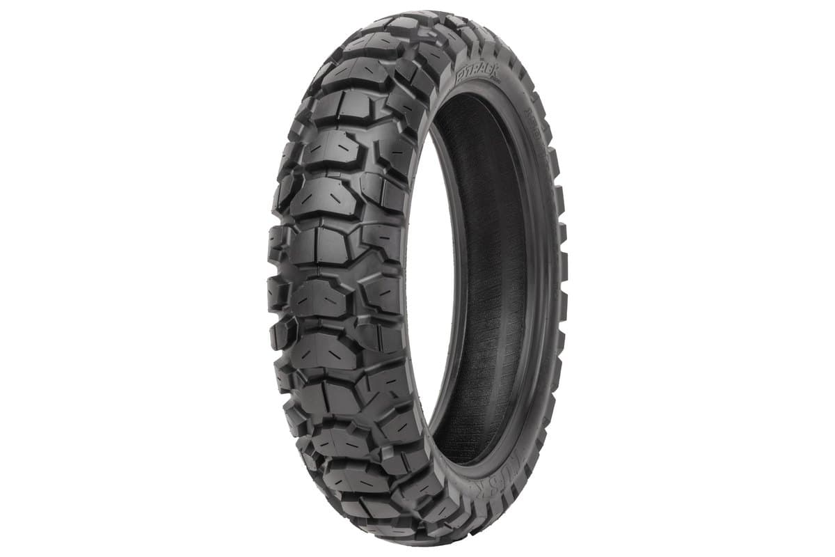 Tusk 2Track Adventure: the rear tire alone at a three-quarter angle, large hexagonal tread blocks filling most of the frame