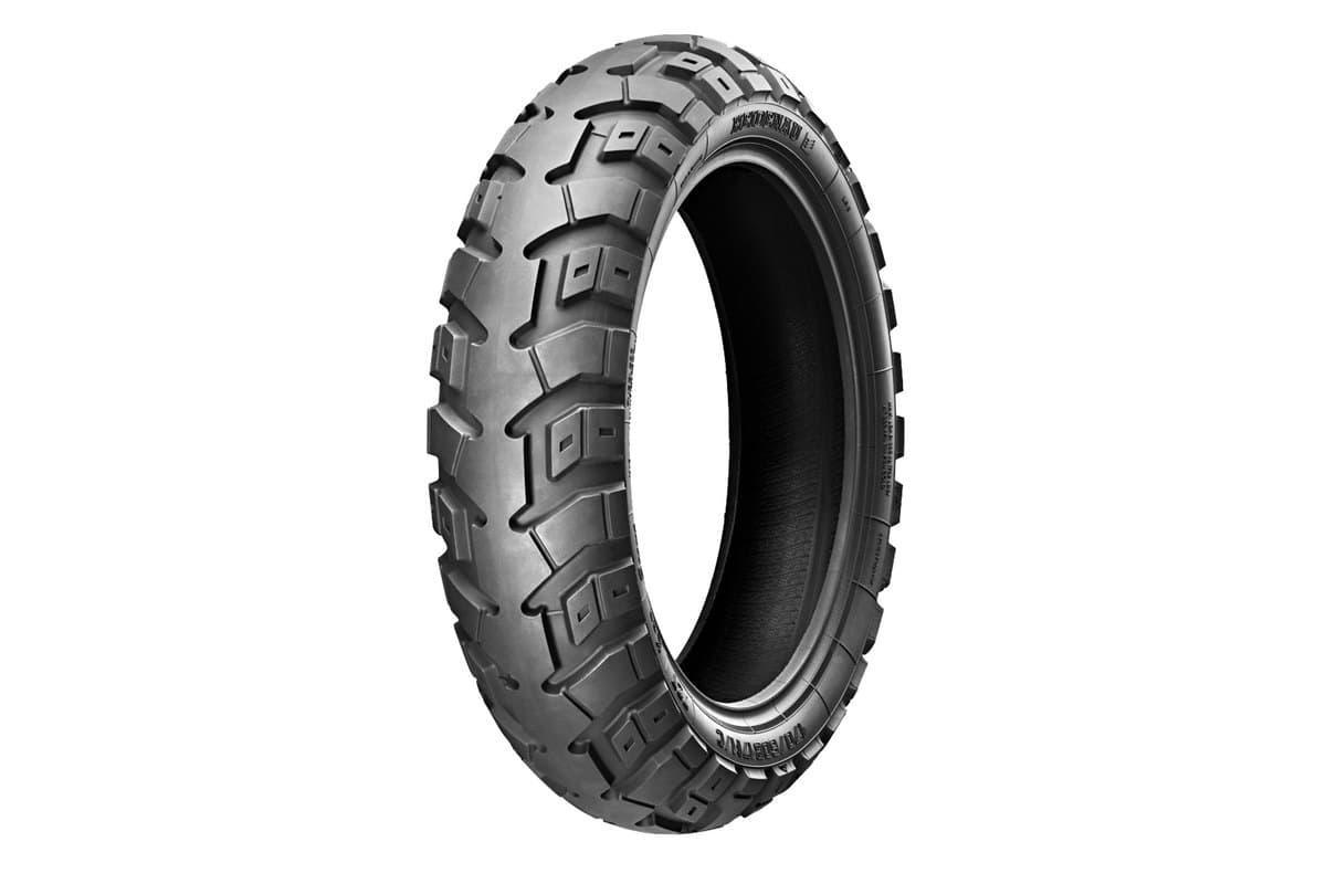 Heidenau K60 Scout: the unmounted rear tire, three-quarter studio view on white, with the brand and size moulded on the sidewall