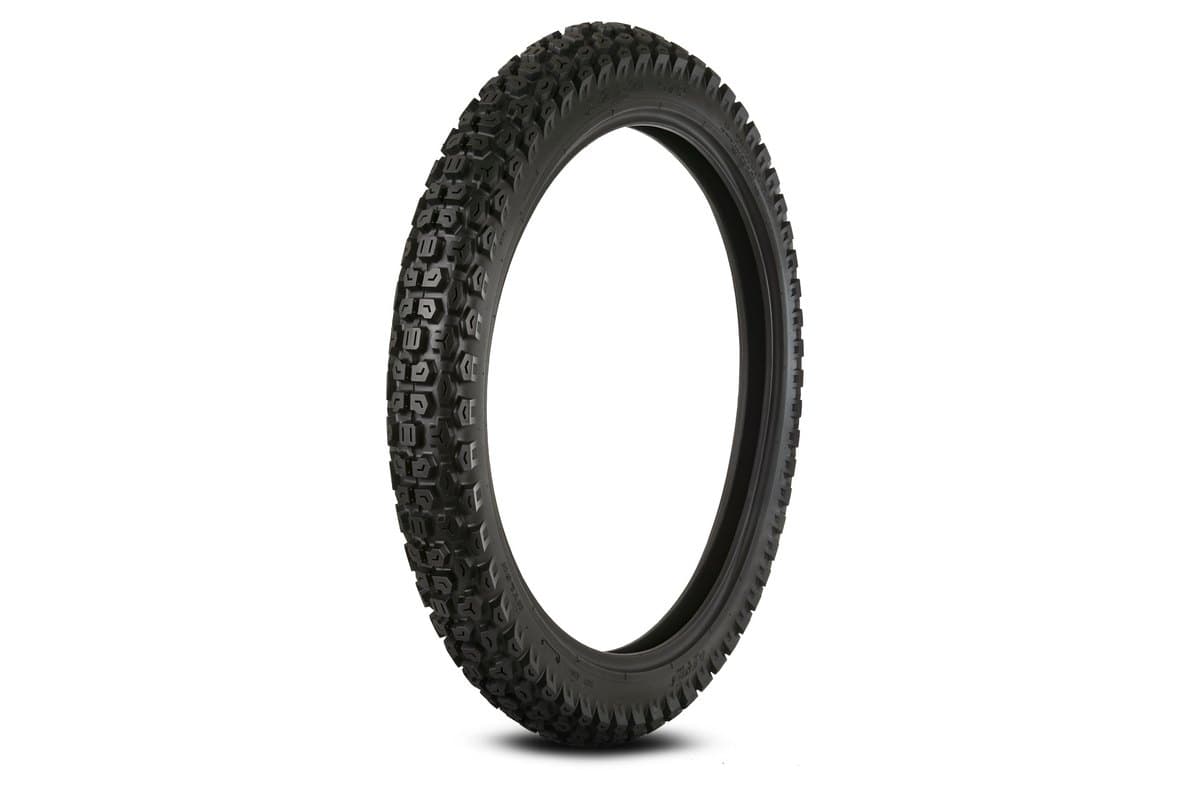 Kenda K270 Dual Sport: front tire, upright three-quarter studio shot on white, tall narrow carcass with a fine studded block pattern