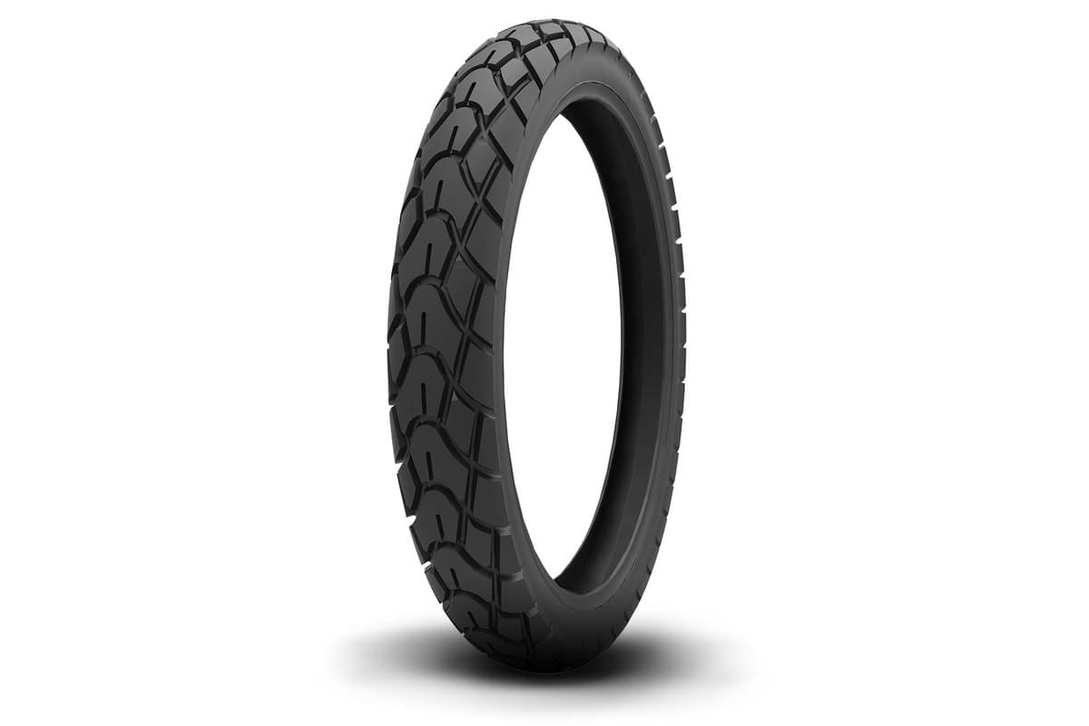 Kenda K761 Dual Sport: narrow motorcycle-size tire, upright three-quarter studio shot on white, interlocking wave and block dual sport tread