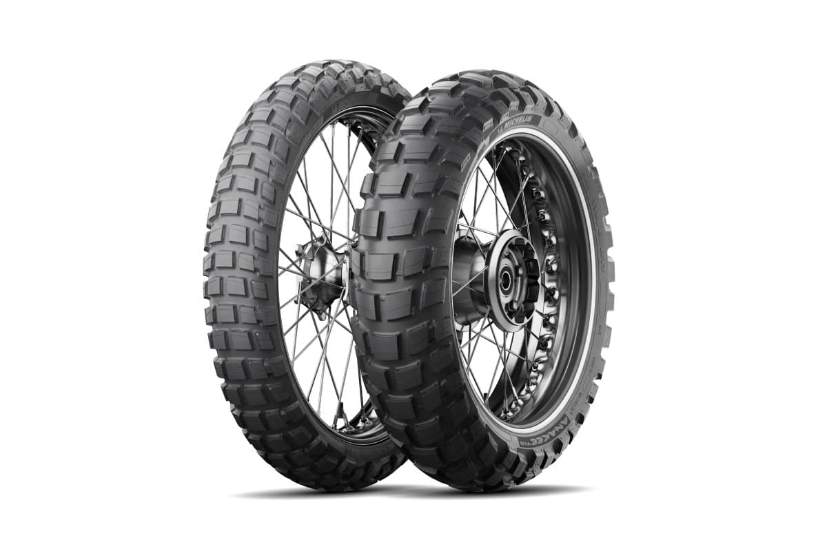 Michelin Anakee Wild: front and rear knobby pair on silver spoked wheels, three-quarter view, with the model lettering on the rear sidewall
