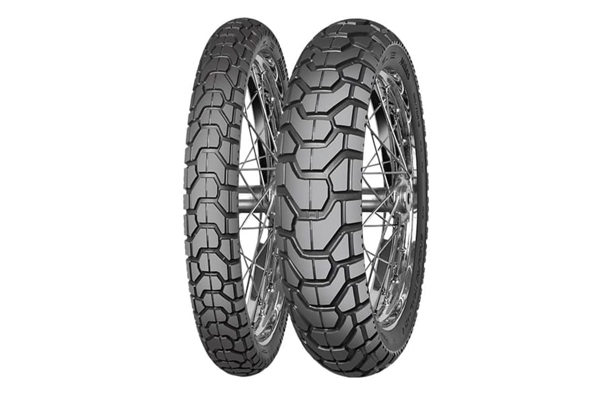 Mitas Enduro Trail-ADV 2: front and rear pair on chrome spoked rims, three-quarter view of the blocky chevron tread, on white