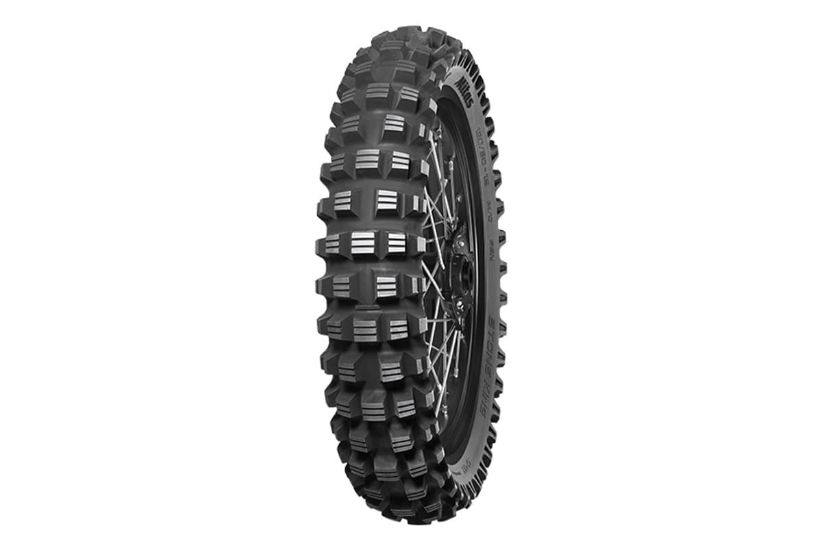Mitas Stone King: a single rear tire on a black spoked rim, tall stepped knobs, three-quarter view on white. A single tire is correct, this model is rear only