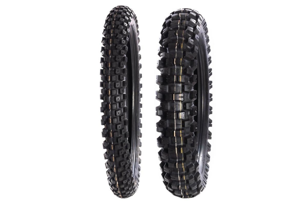 Motoz Tractionator Enduro I/T: front and rear pair standing upright side by side on white, the narrow front at left with a tan centre stripe and the wider rear at right with white and yellow stripes