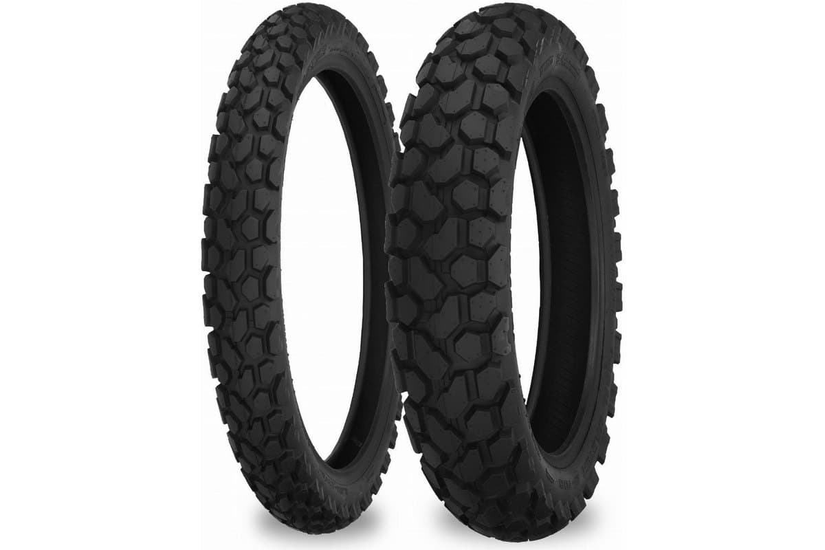 Shinko 700 Series Dual Sport: front and rear pair side by side on white, the narrow front at left and the fatter rear at right, both carrying the hexagonal block tread