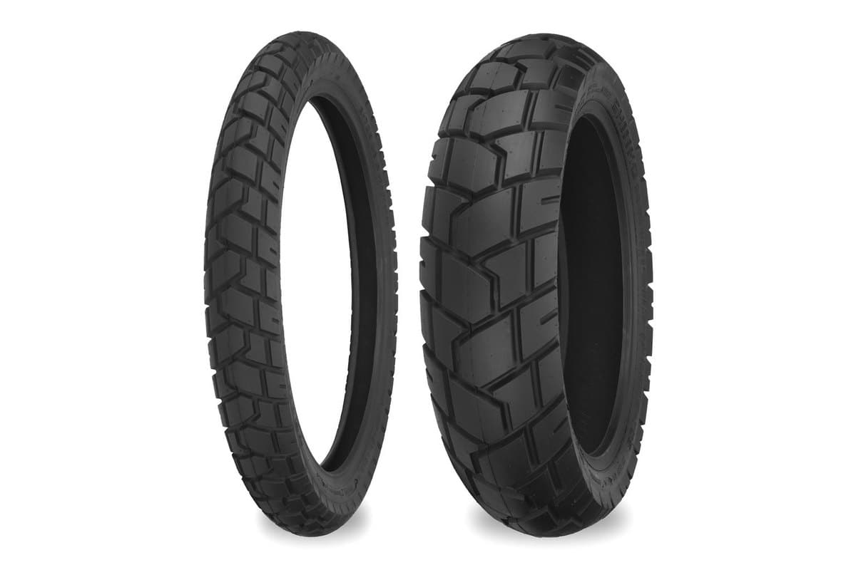 Shinko 705 Series Dual Sport: front and rear pair side by side on white, the narrow front at left with angled blocks and the wider, blockier rear at right