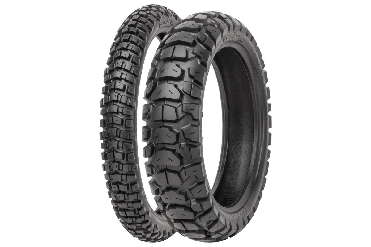 Tusk 2Track Adventure: front tire standing behind and rear angled in front, with the model and brand moulded on the sidewalls, on white