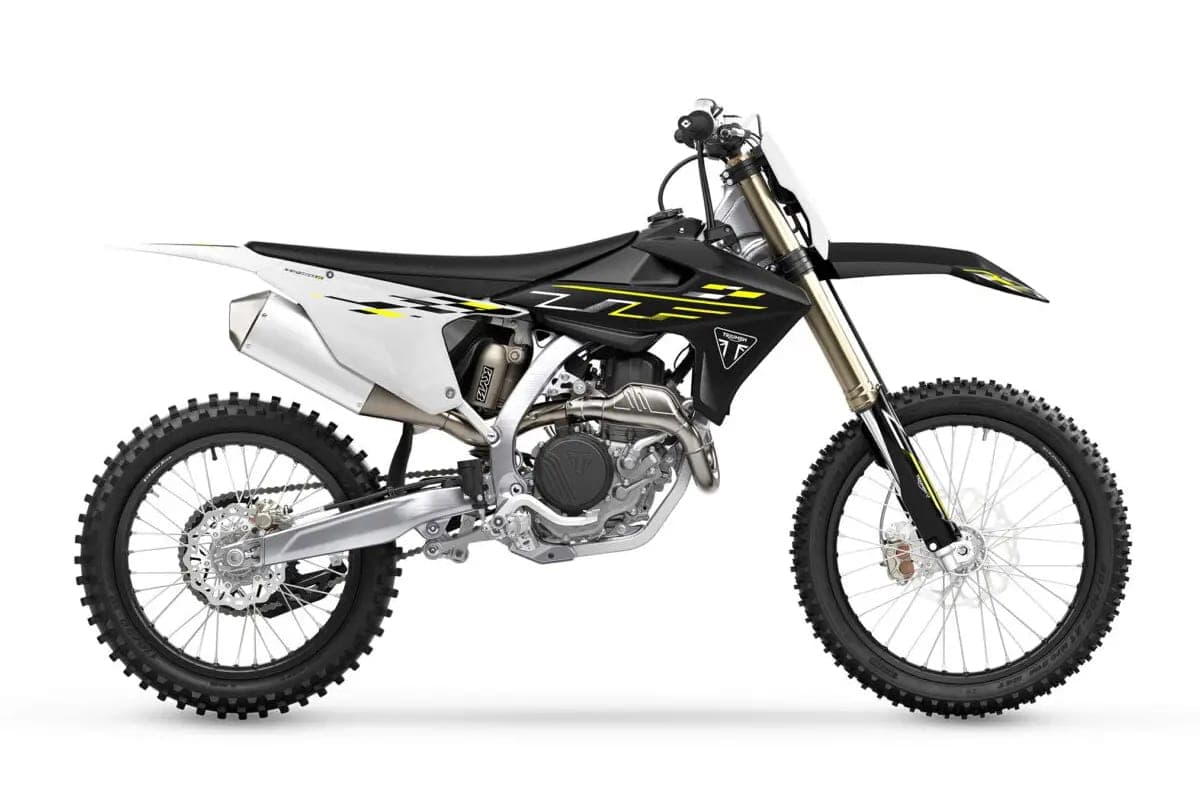 2026 Triumph TF 450-X motocross bike in black and white with yellow accents, right-side studio profile showing gold forks and titanium exhaust