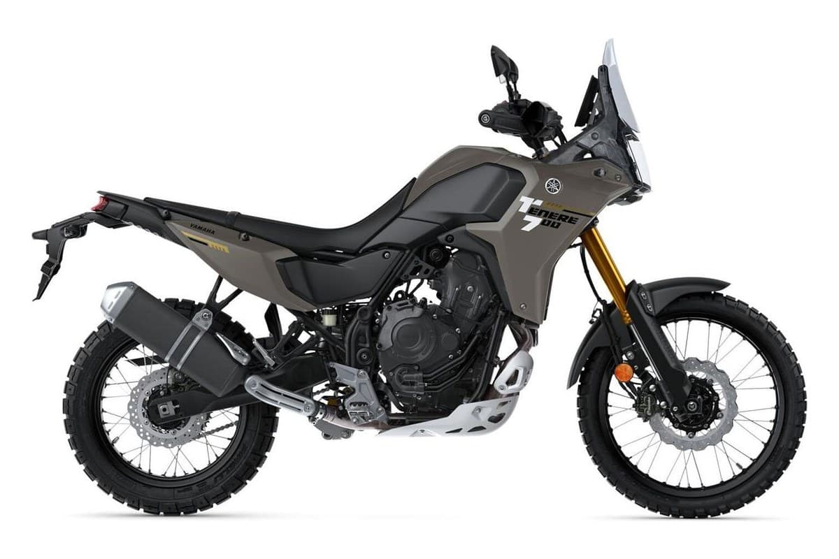 2026 Yamaha Ténéré 700 dual-sport in Team Yamaha Blue, left-side studio profile showing spoked wheels, upswept exhaust and rear rack mount