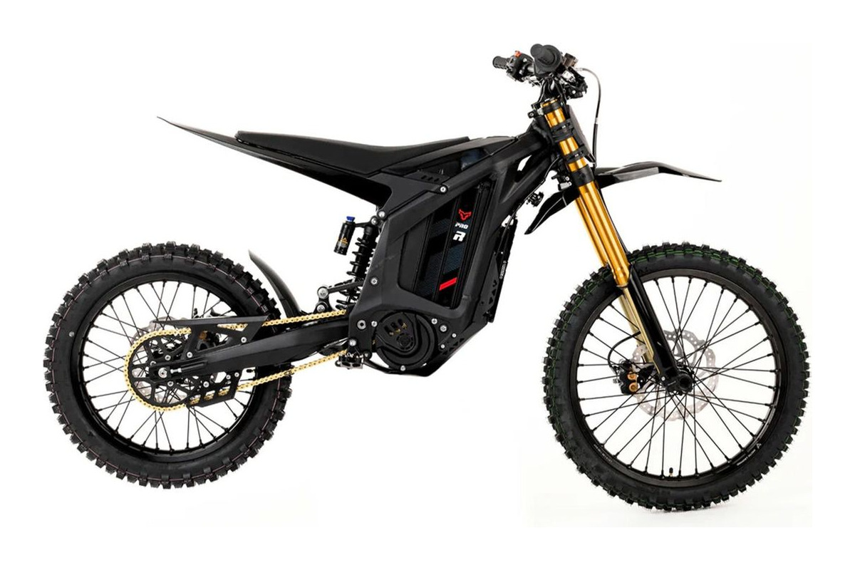 Arctic Leopard XE Pro R electric dirt bike in black with gold forks, right-side studio profile on a white background