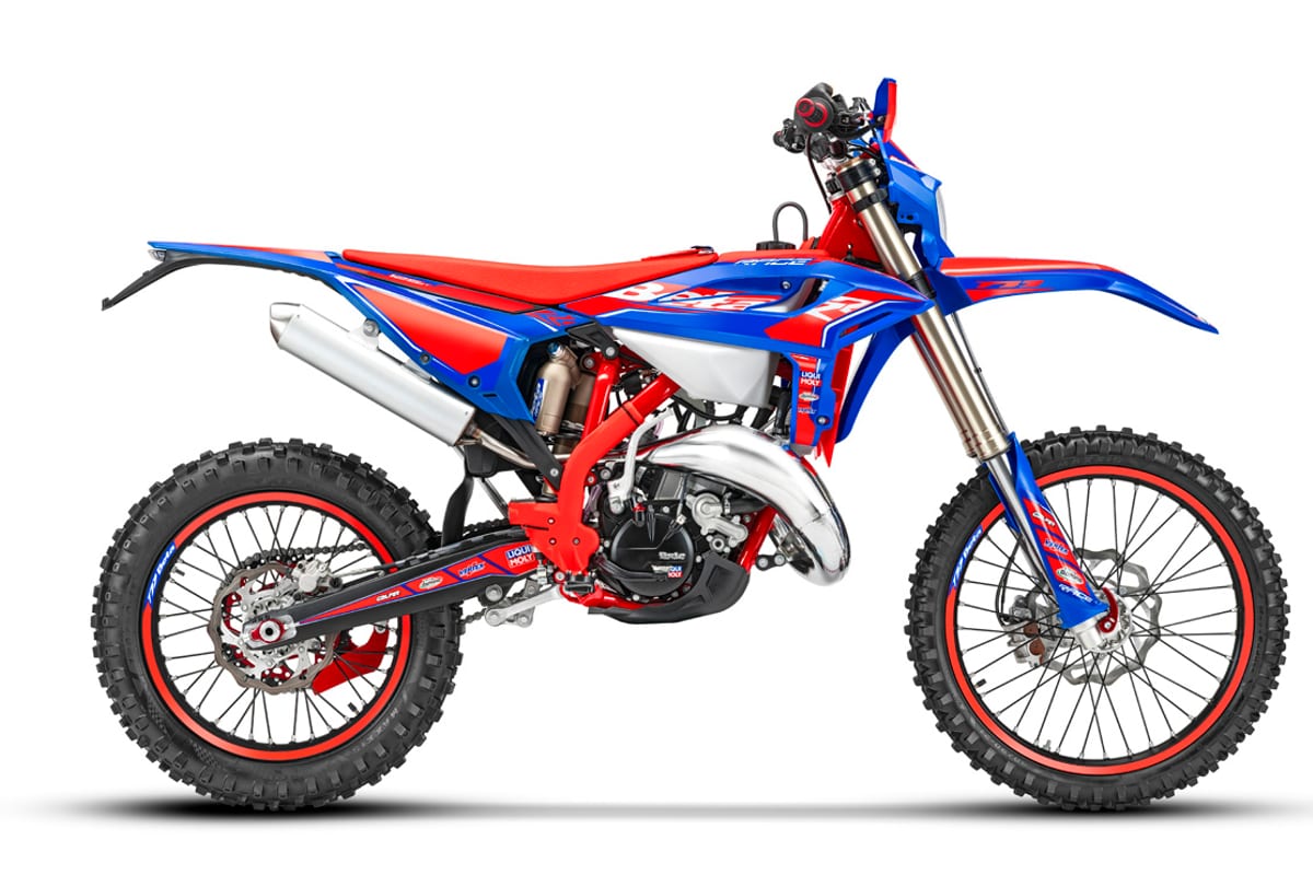 2026 Beta 300 RR Race enduro motorcycle in blue and red, left-side studio profile showing the exposed pipe, red frame and red-rimmed wheels