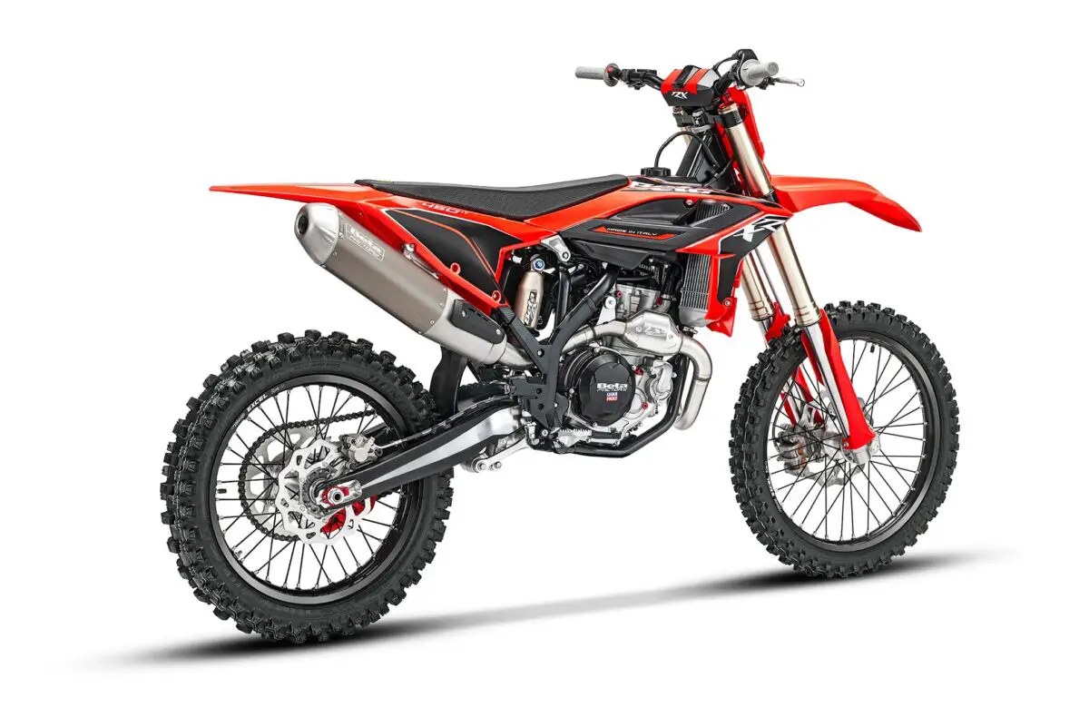 2027 Beta 450 RXF motocross bike in red and black, rear three-quarter studio profile showing the exhaust, spoked wheels and knobby tires