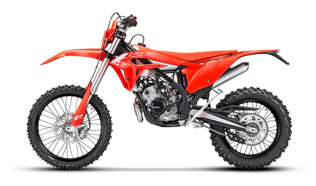 2027 Beta Xtrainer 200 enduro motorcycle in red, right-side studio profile on a white background showing the exhaust silencer and spoked wheels