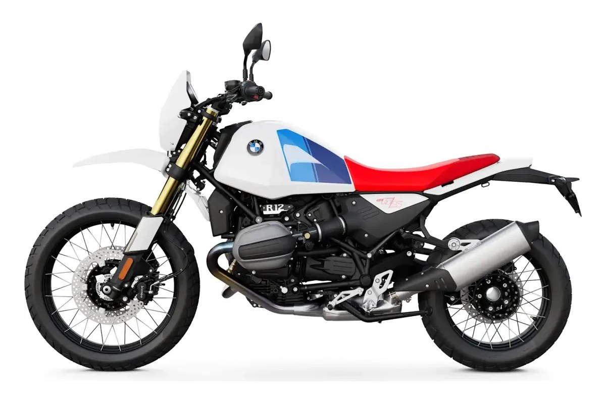 2027 BMW R 12 G/S adventure motorcycle in white with red seat and blue tank graphics, left-side studio profile showing spoked wheels and boxer engine