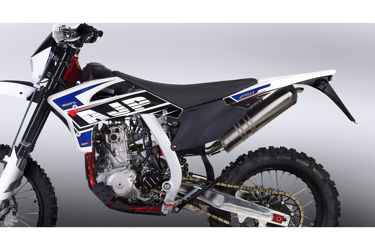 Close-up of the AJP SPR250's left side, showing the 249cc liquid-cooled engine, seat and aluminium swingarm