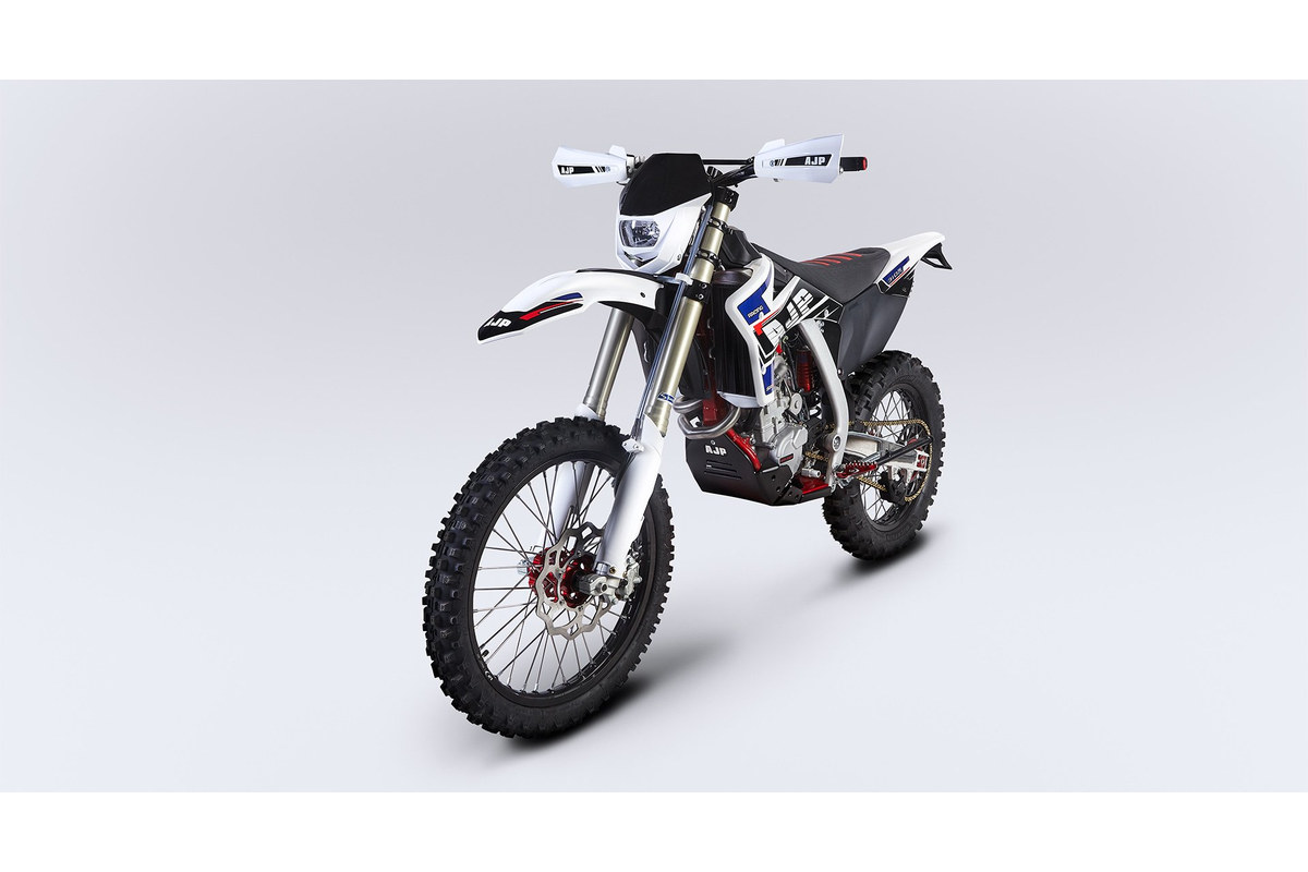 AJP SPR310R front three-quarter studio view showing the enduro headlight cowl, Sachs 48mm fork and Brembo front disc