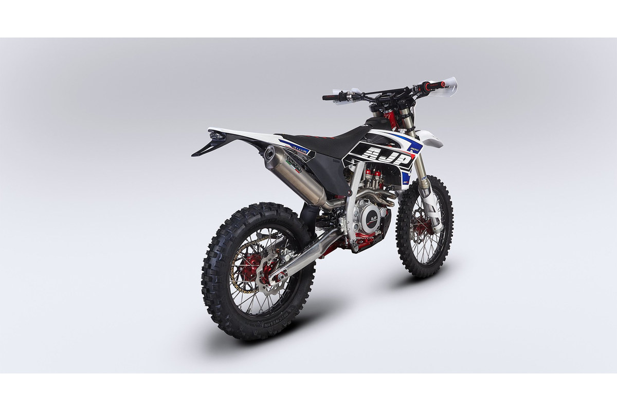 AJP SPR310R rear three-quarter studio view showing the muffler, rear fender and 18-inch rear wheel