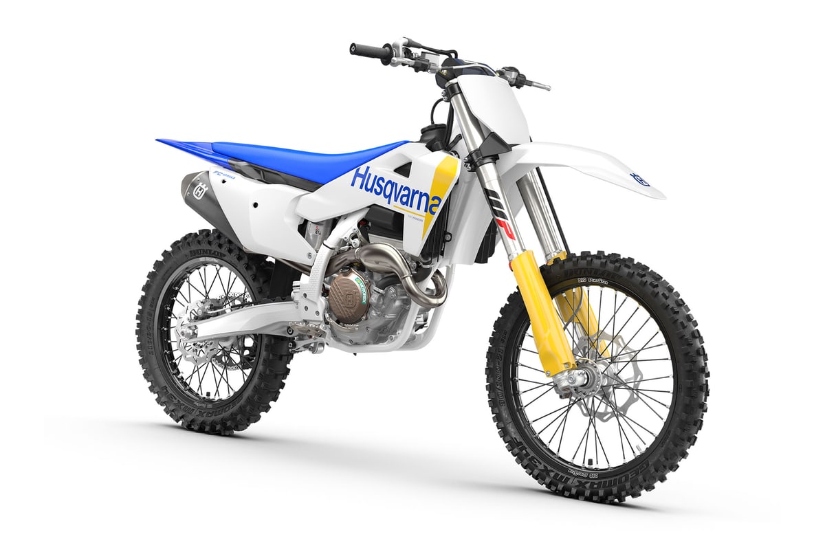 Husqvarna FC 250 front three-quarter studio view showing the front number plate, fork guards and front disc