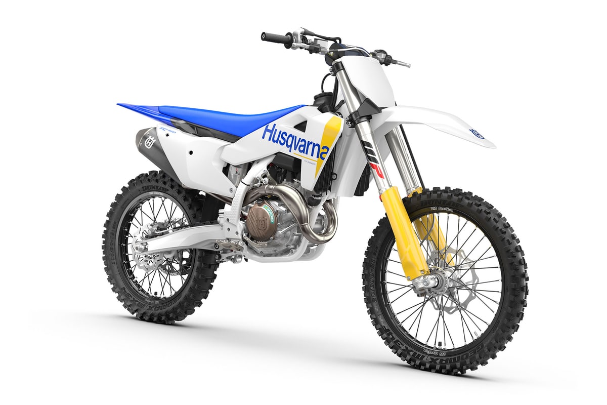 Husqvarna FC 450 rear three-quarter studio view highlighting the blue seat, rear disc and airbox