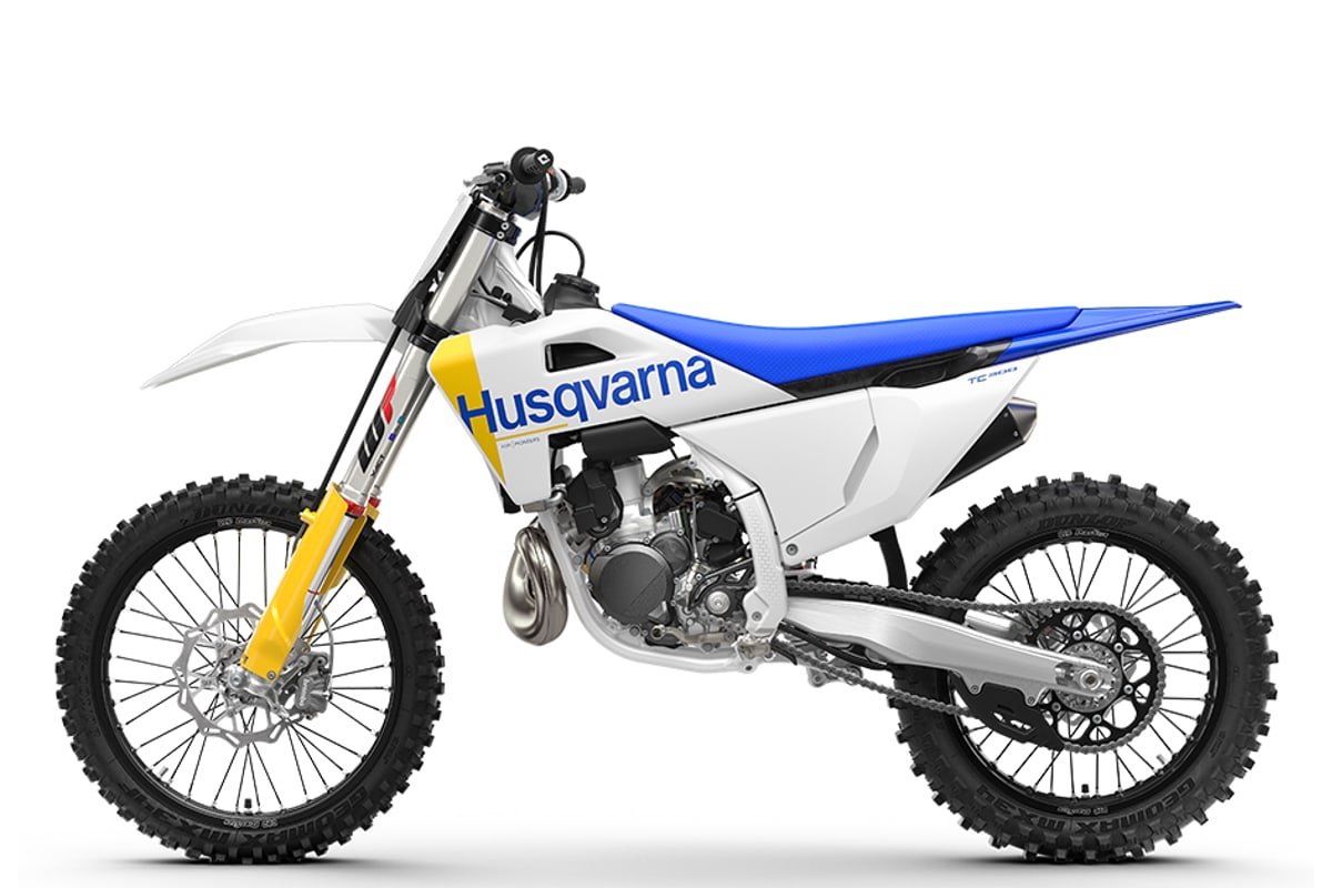 Husqvarna TC 300 left-side studio profile showing the chain, linkage shock and silencer