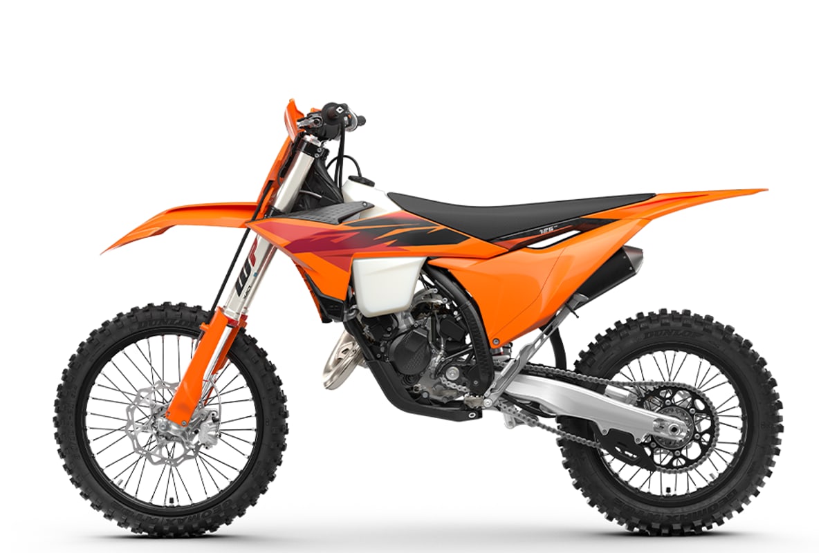 KTM 125 XC left-side studio profile showing the chain, linkage shock and silencer