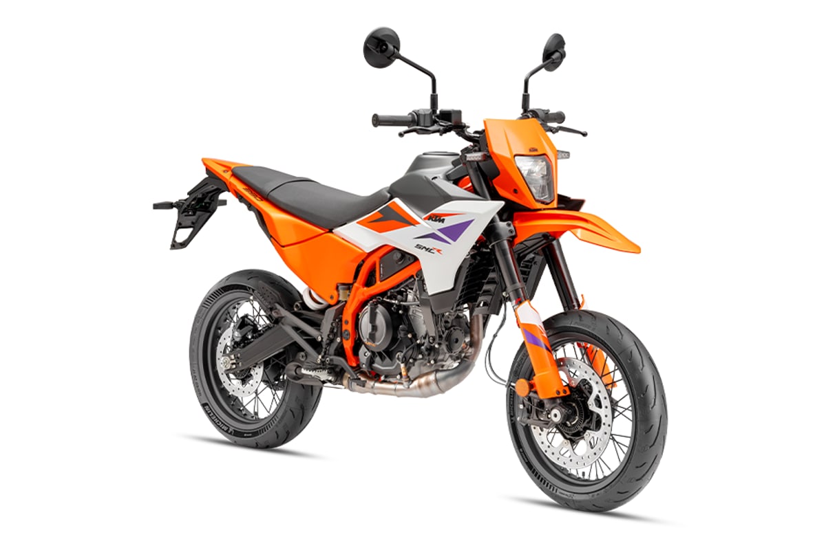 KTM 390 SMC R right-front studio view showing the headlight mask, radial front caliper and 320mm disc