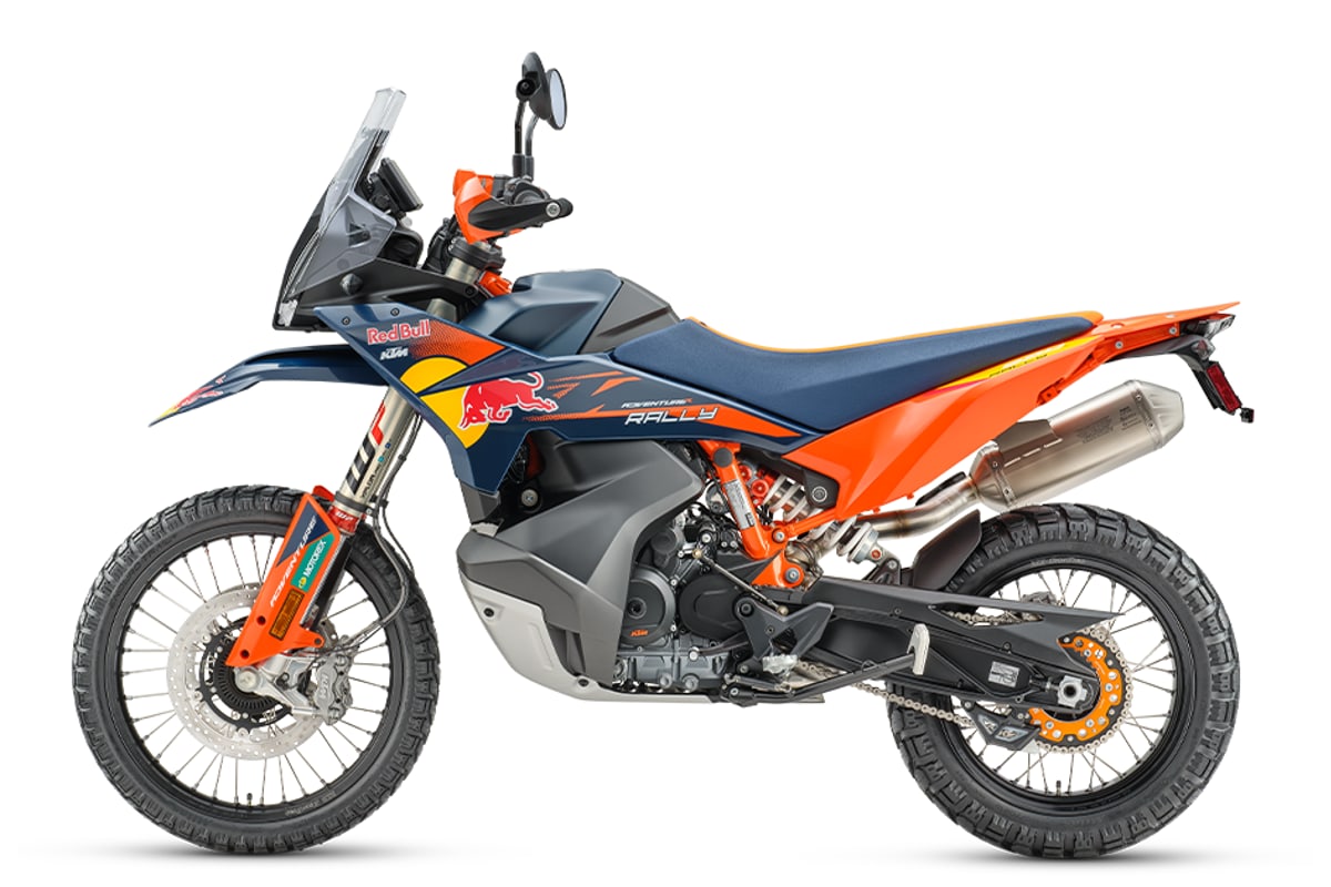 KTM 890 Adventure R Rally left-side studio profile showing the Akrapovic silencer, chain and skid plate