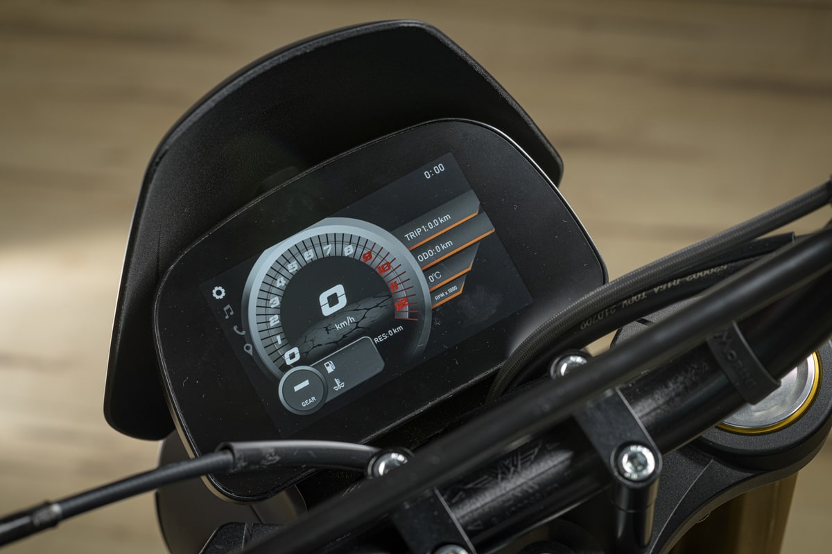 The Seiemmezzo SCR's LCD-TFT instrument display behind its fly screen, showing the tachometer arc and gear indicator