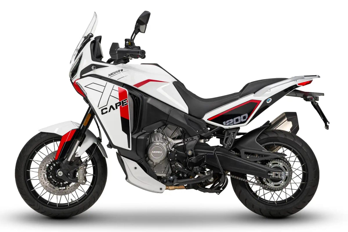 Moto Morini X-Cape 1200 in white and red, right-side studio profile highlighting the tall windscreen, chain drive and stubby exhaust can