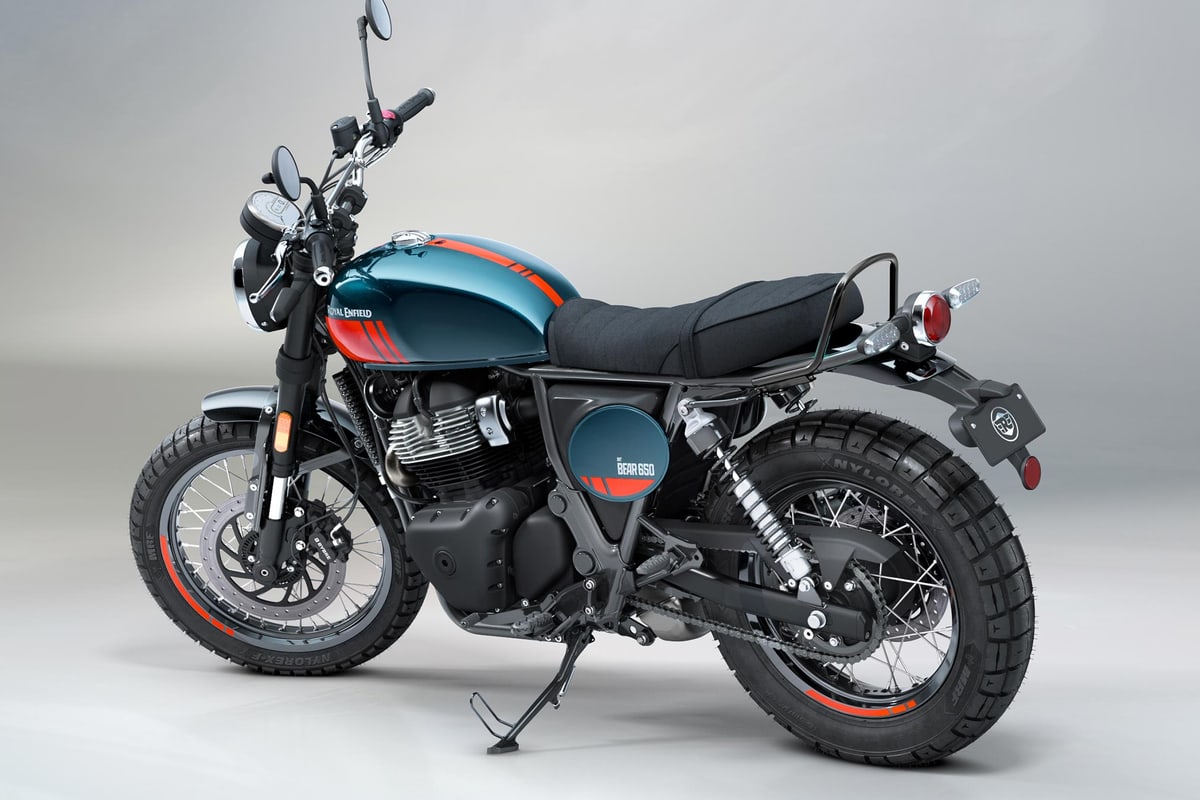 Royal Enfield Bear 650 in petrol green, rear three-quarter studio view showing the 2-into-1 exhaust, grab rail and round tail light