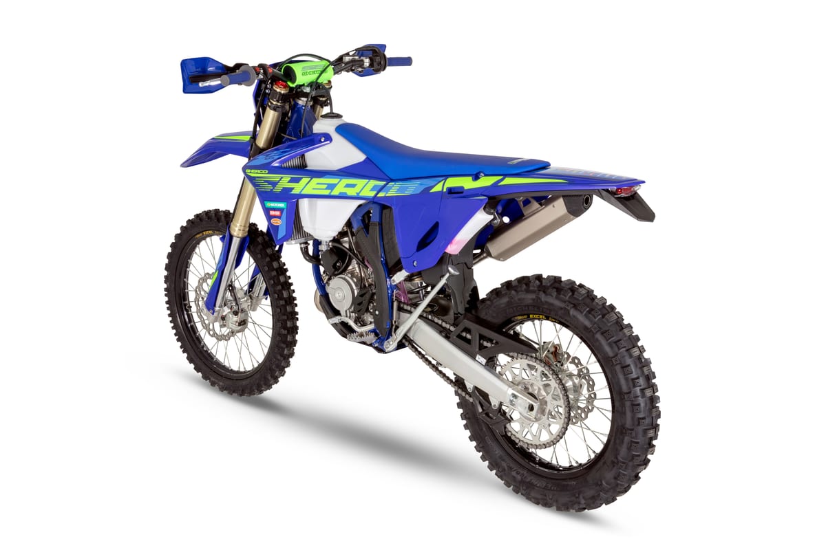 Sherco 125 SE Factory rear three-quarter studio view highlighting the white tank shrouds, chain guard and shock linkage