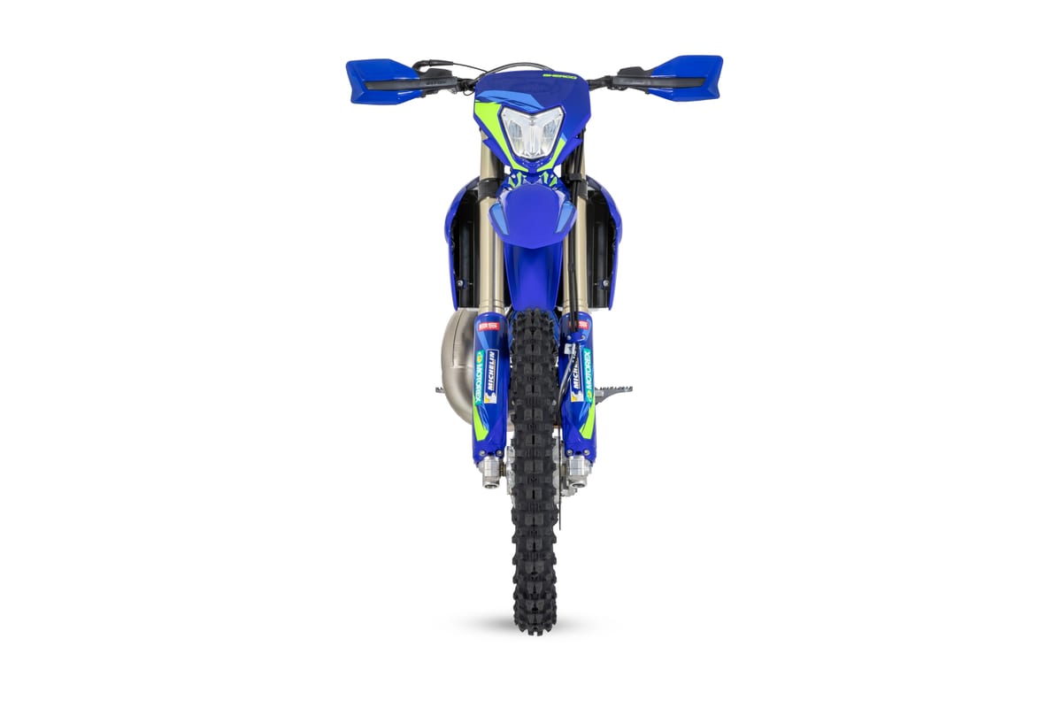 Sherco 125 SE Factory head-on studio shot showing the LED headlight, handguards, front fender and knobby front tire