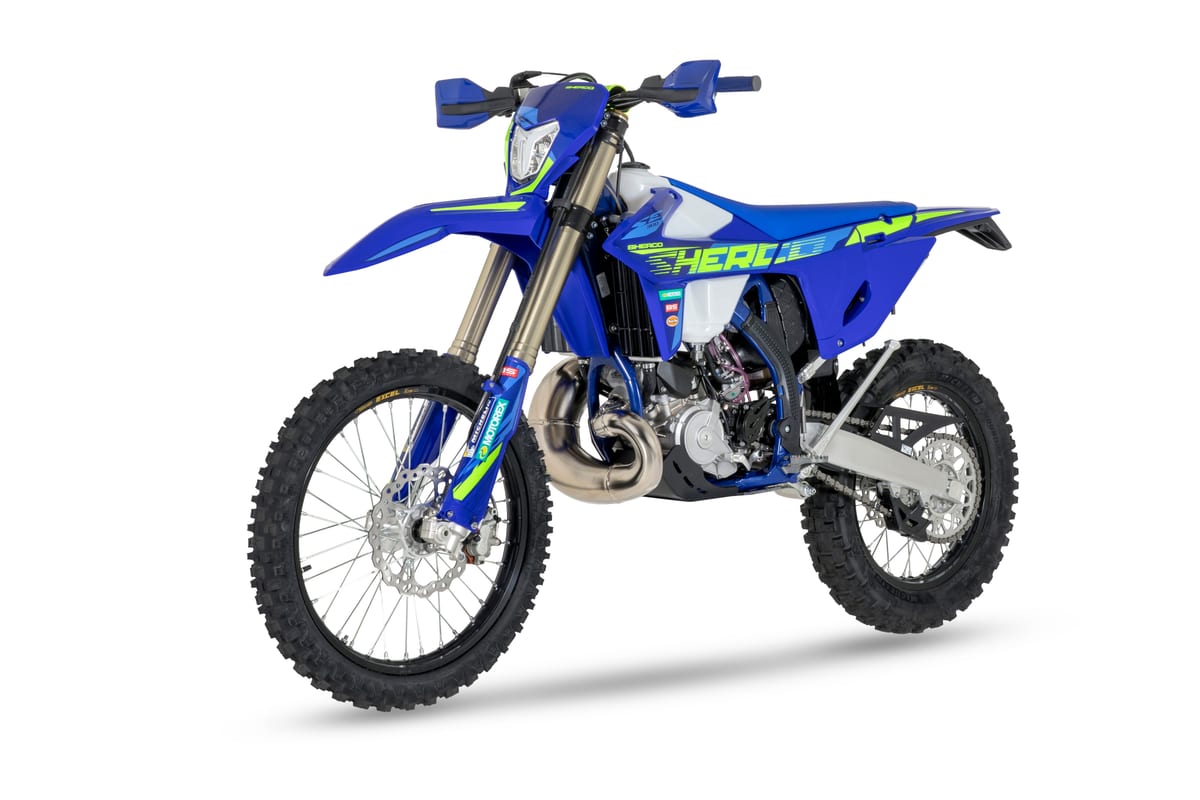 Sherco 300 SE Factory front three-quarter studio view highlighting the hi-vis graphics, radiator shrouds and knobby Michelin tires