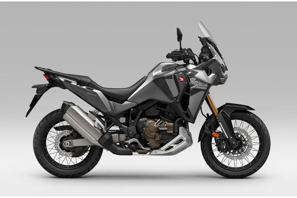 2026 Honda Africa Twin Adventure Sports ES in gunmetal grey, right-side studio profile showing gold forks, spoked wheels and tall touring windscreen