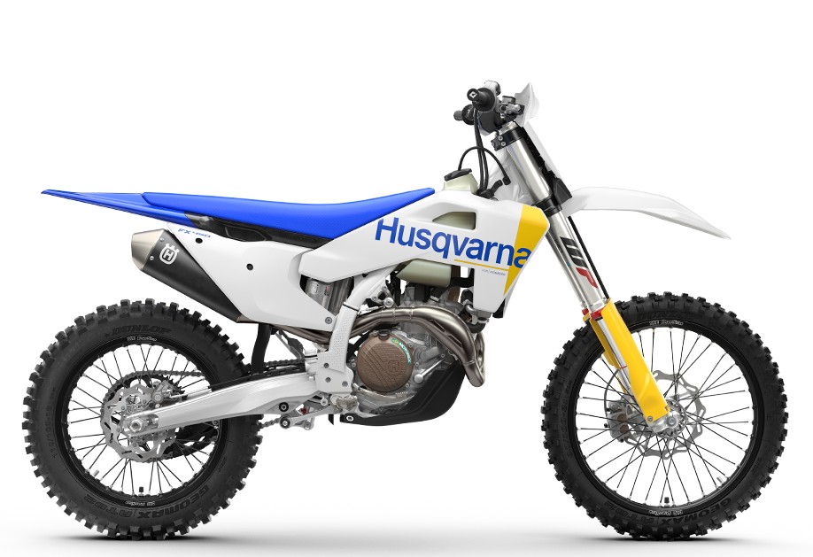 2027 Husqvarna FX 450 cross-country bike in white and blue, right-side studio profile showing WP yellow forks and Dunlop knobby tires