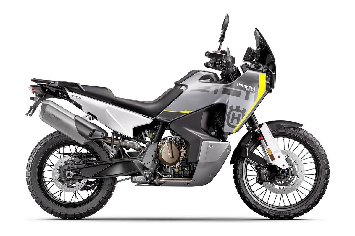 2027 Husqvarna Norden 901 adventure motorcycle in grey and white with yellow accents, left-side studio profile showing spoked wheels and beak fender
