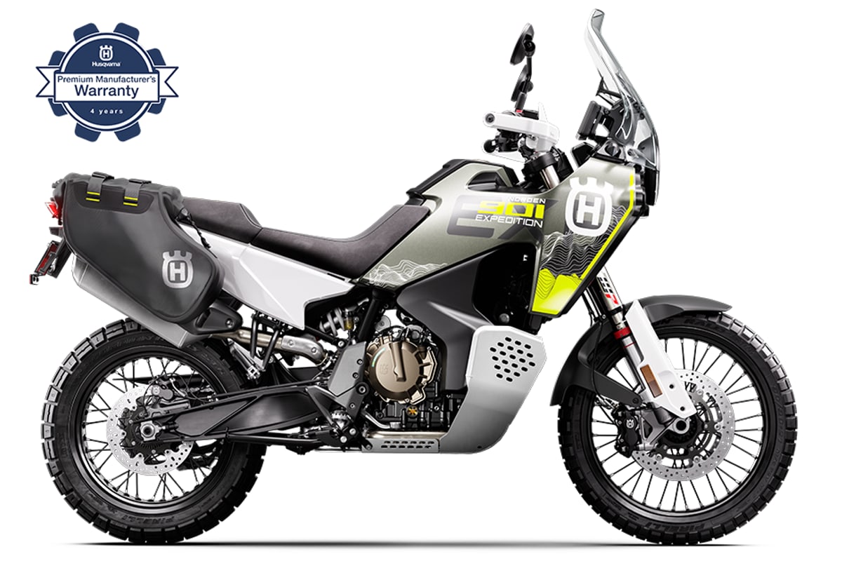 2027 Husqvarna Norden 901 Expedition in grey and yellow, right-side studio profile showing the tall screen, crash bars and spoked tubeless wheels
