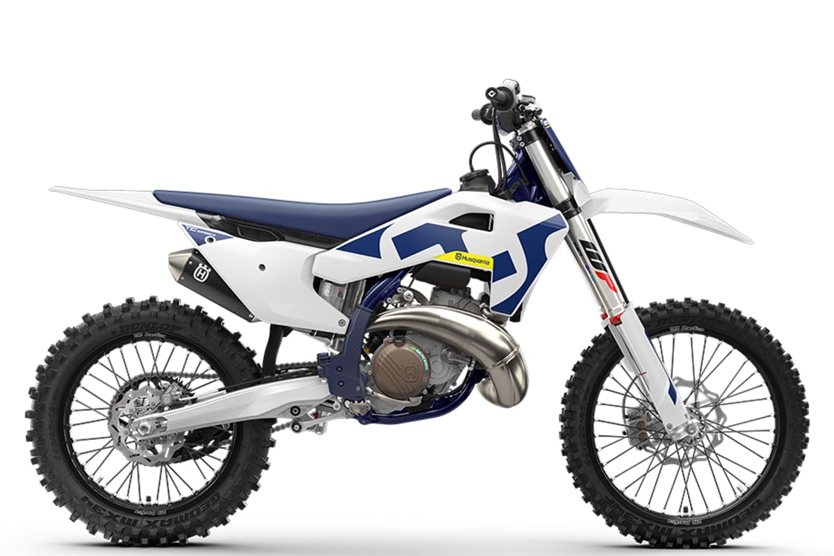 2027 Husqvarna TC 250 two-stroke motocross bike in white and navy, right-side studio profile showing WP forks and expansion chamber pipe