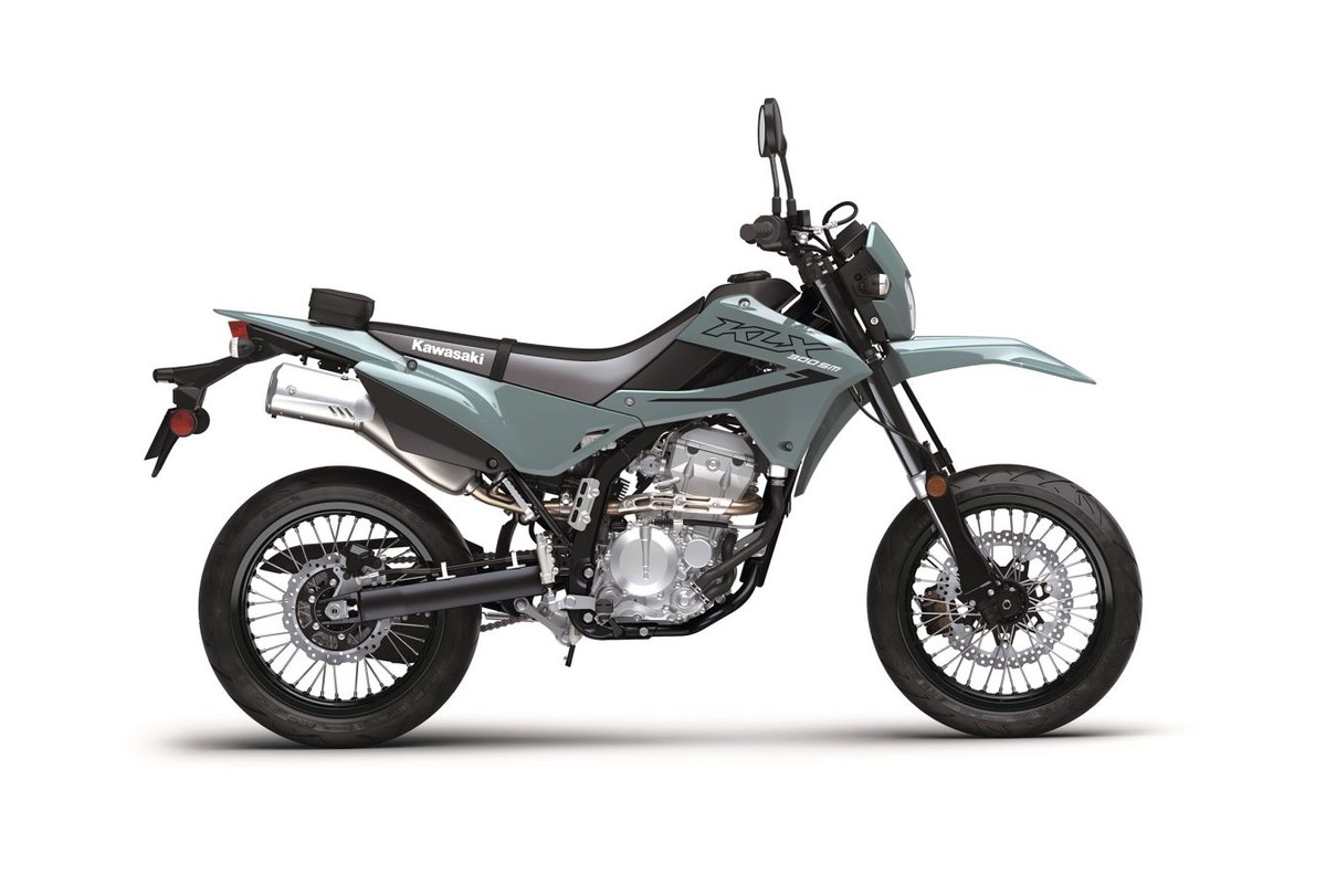 2026 Kawasaki KLX300SM supermoto in seafoam green, right-side studio profile showing spoked wheels, upside-down forks and stubby exhaust