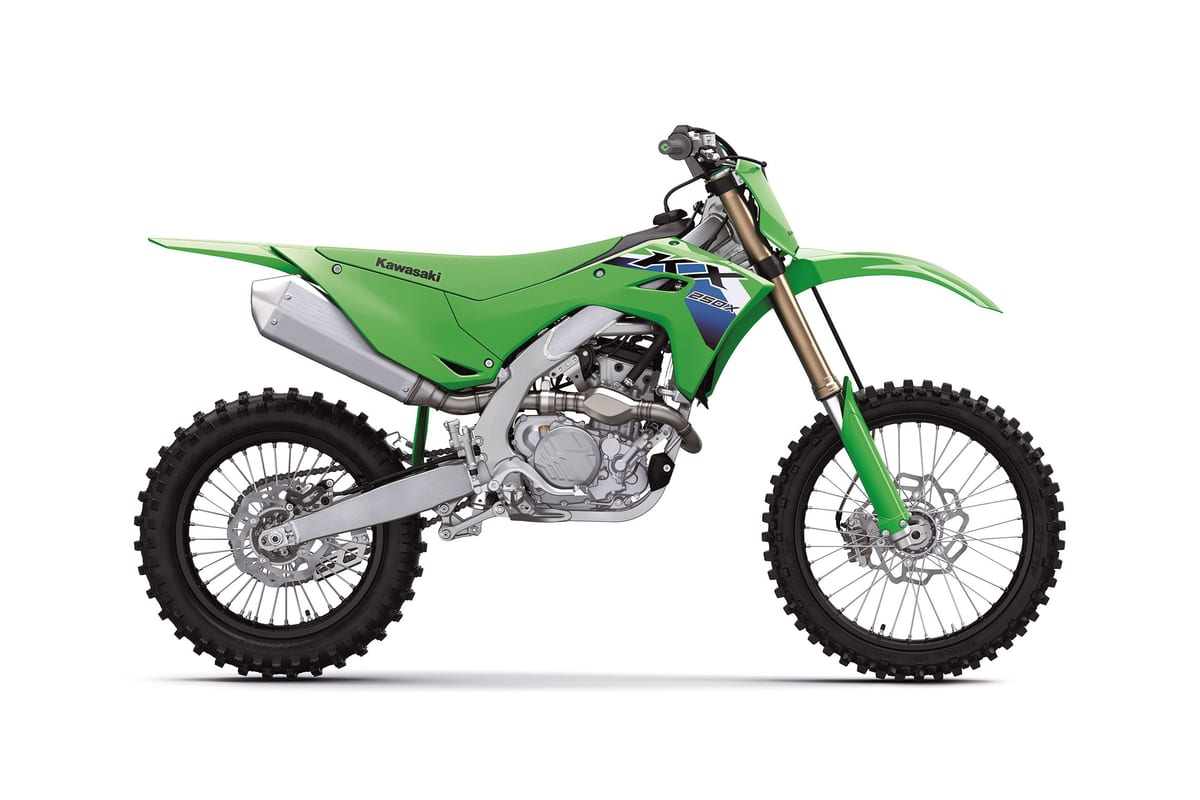 2027 Kawasaki KX250X cross-country bike in lime green, right-side studio profile showing the gold-coated fork, silver exhaust and blue KX graphics